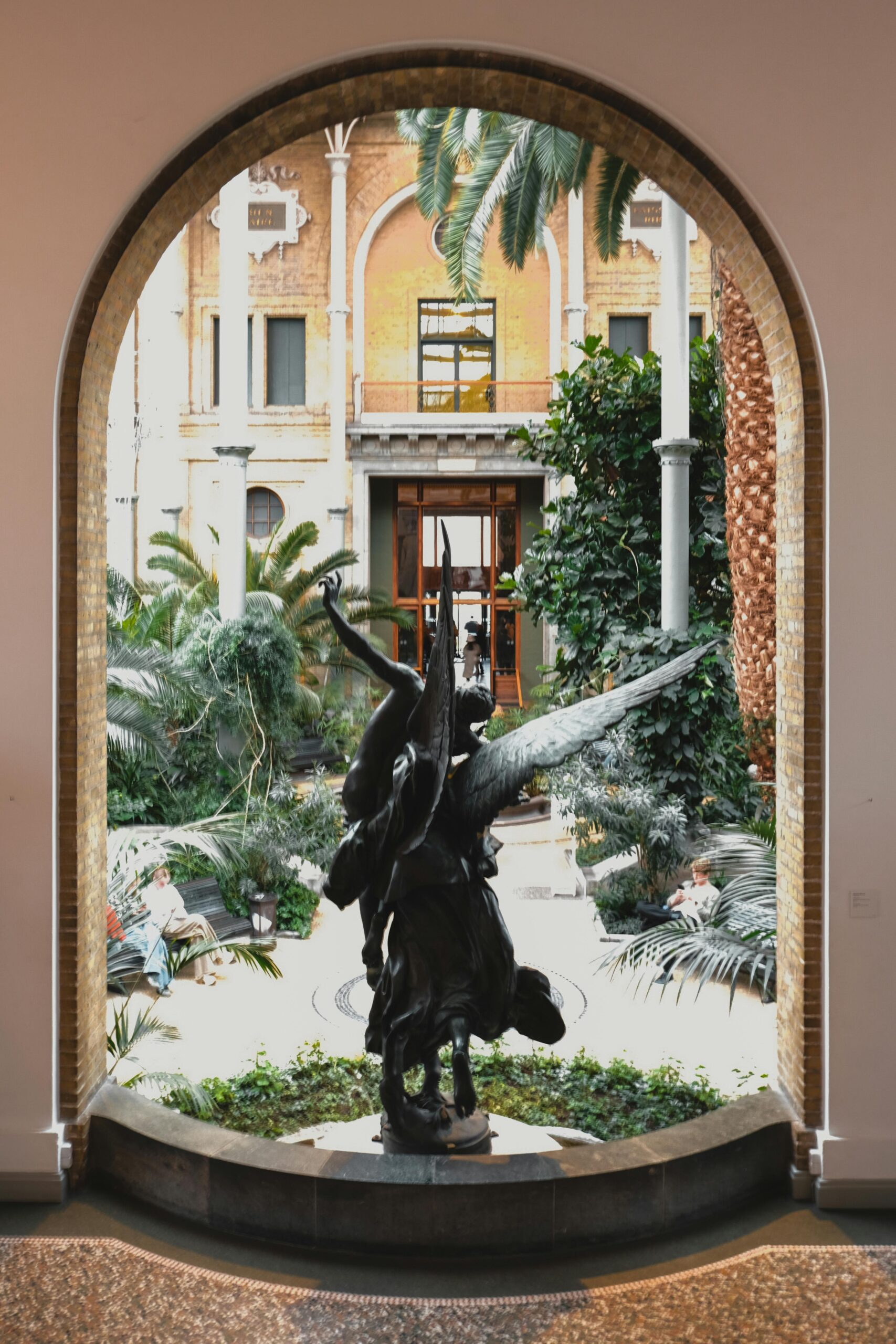 Hidden courtyard in Copenhagen with greenery and sculpture, a quiet spot away from tourist routes